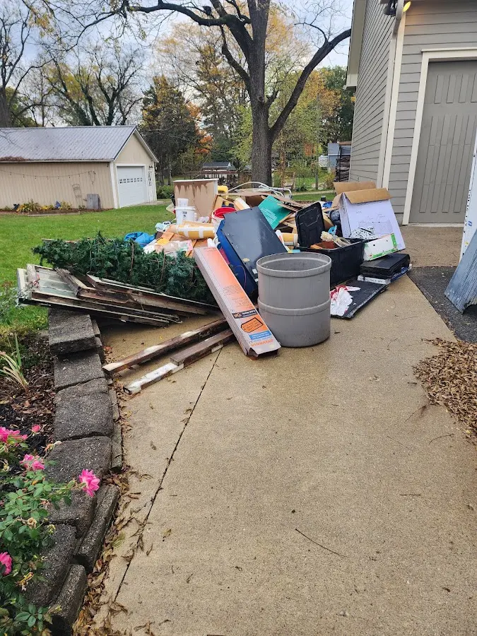 Dumpster being loaded with debris for Roofing Dumpster Rental in Capitola